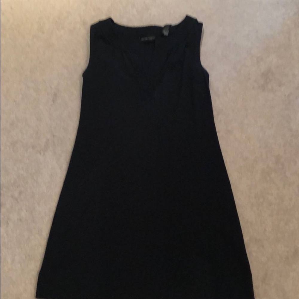 Sleeveless black summer dress.